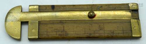 An antique wood and brass rope gauge 31 x 24cm .