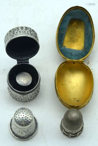 A silver pill box together with another 1892 silver thimble ...