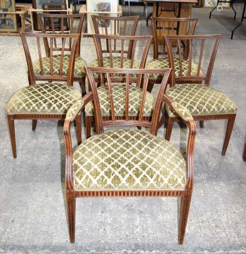 A set of seven Art Deco style dining chairs with upholstered...