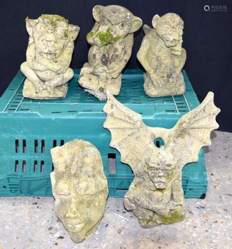 A collection of stone composite Gargoyle garden statues larg...