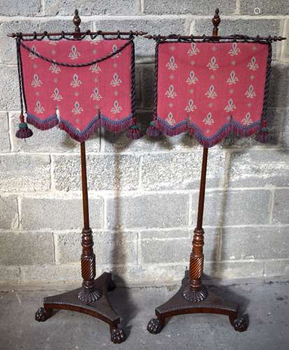 A pair of William IV fabric Fire screens set on wooden poles...