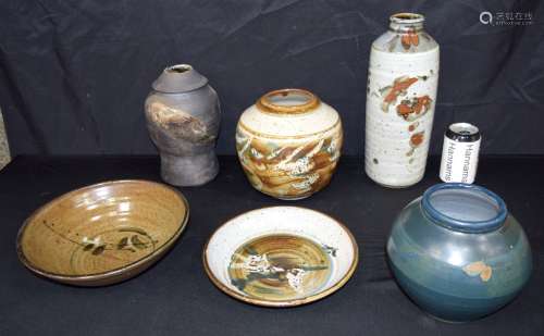 A collection of glazed studio pottery including vases & bowl...