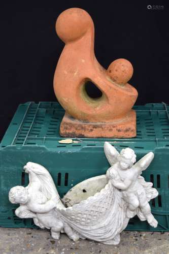 A Terracotta garden feature depicting a mother and baby toge...
