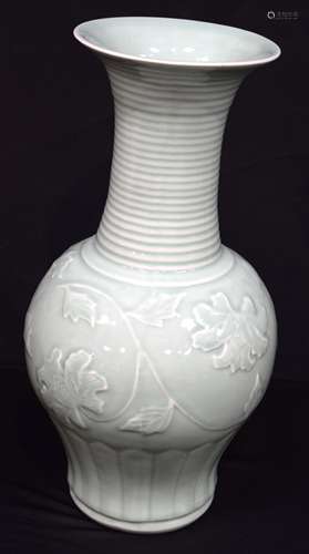 A large Chinese porcelain Celadon vase decorated in relief w...