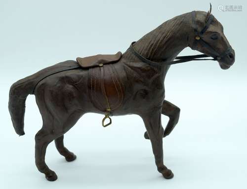 A vintage leather horse possibly French 28 x 37cm .