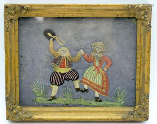 A small framed 19th century embroidery of a couple dancing p...