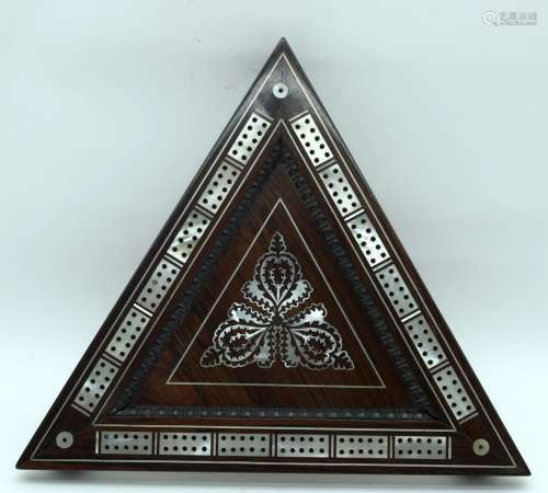 A rare triangle shaped wooden 19th century cribbage board wi...