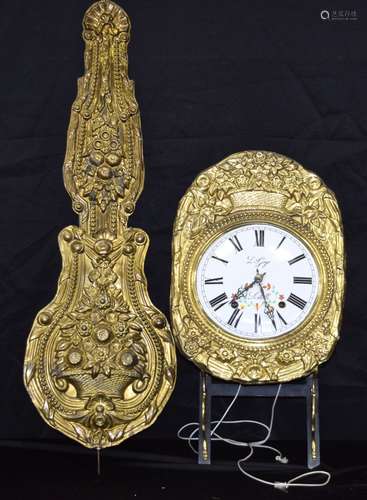 A French enamelled metal clock with pendulum and bracket 181...