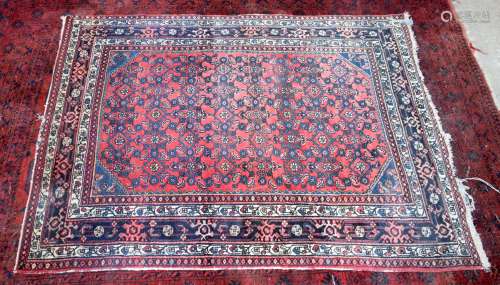 A Persian rug 199 x 144 cm.