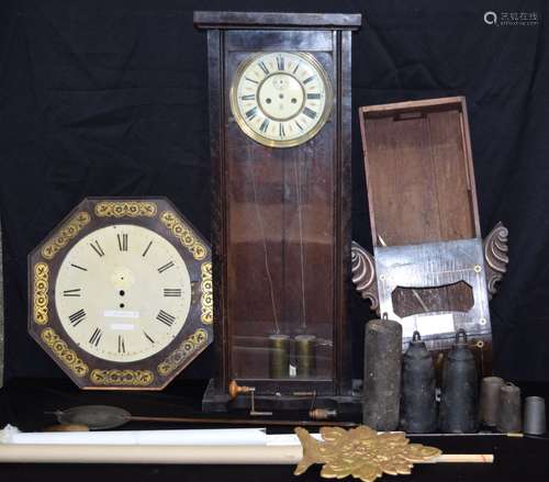 A collection of clock cases, mechanisms, pendulum weights et...