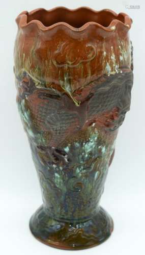A Torquay ware pottery vase decorated with a dragon 29cm.