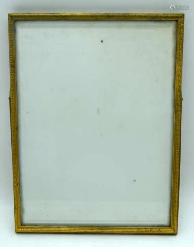An antique heavy brass glazed picture frame 31 x 24cm .