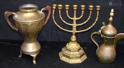 A wooden handled brass Samovar, together with a brass candle...