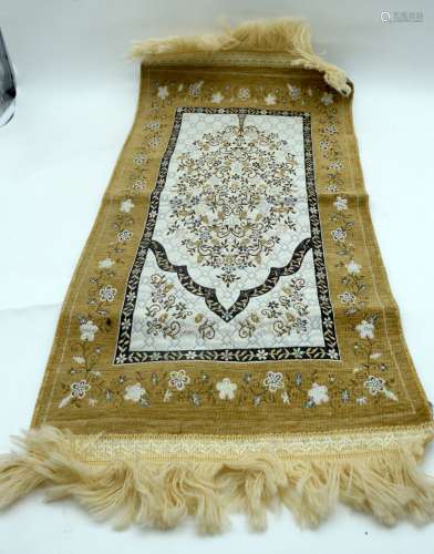 A small Islamic metal thread rug or hanging with a central T...