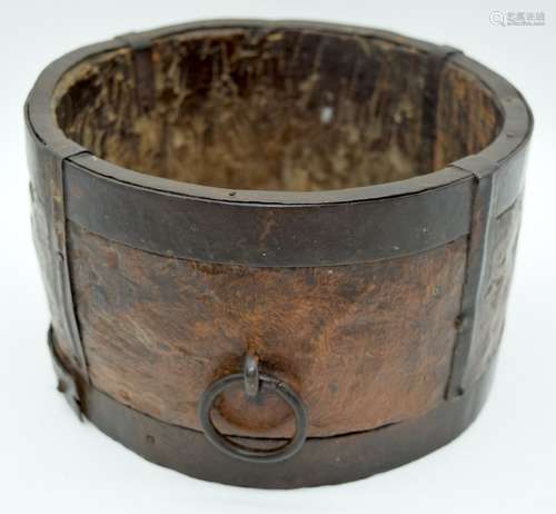 A 19th century metal bound and carved wooden bucket possibly...