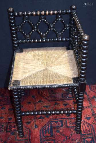 An antique Bobbin turned corner chair with reed work seat 67...