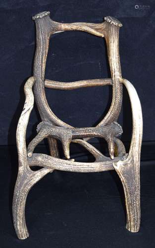 A vintage stag antler child's chair 42 x 37 x 30cm.