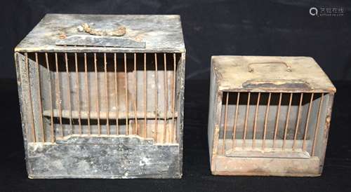 A folk art wooden bird cage together with another (2)