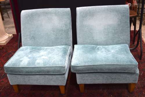 A pair of Delcor low fabric armchairs. 78 x 75 x 67 cm