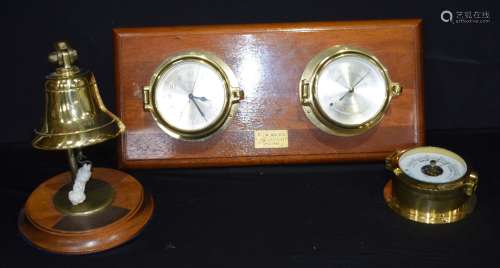 A mounted clock and barometer set together with a desk bell ...