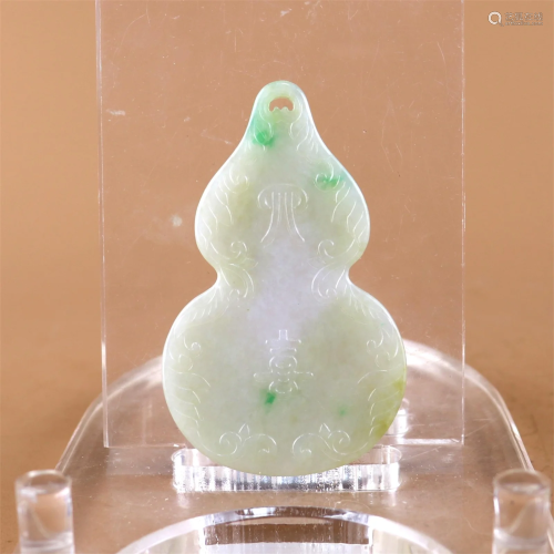 A Carved Jadeite Gourd Shaped Pendant