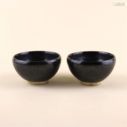 Pair of Black Glazed Tea Cups and Saucer