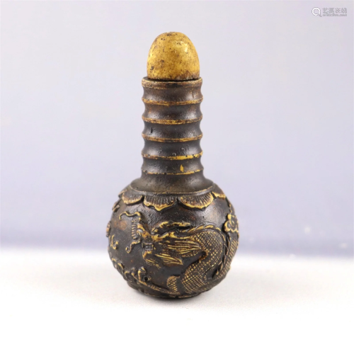 A Carved Hardwood Snuff Bottle with Dragon Pattern