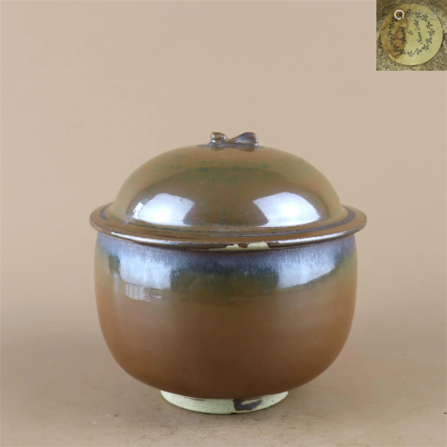 A Brown Glazed Porcelain Bowl With Lid