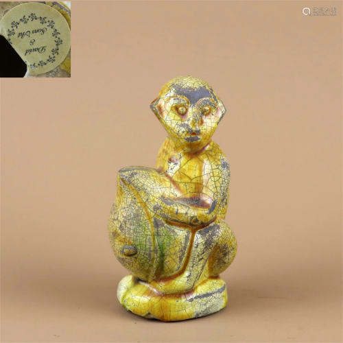 A Yellow Glazed Porcelain Monkey Shaped Decoration