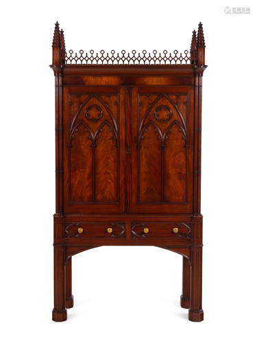 A Gothic Style Carved Mahogany Cabinet with P.E. Guerin