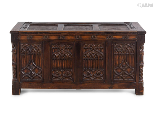 A Gothic Revival Carved Oak Chest