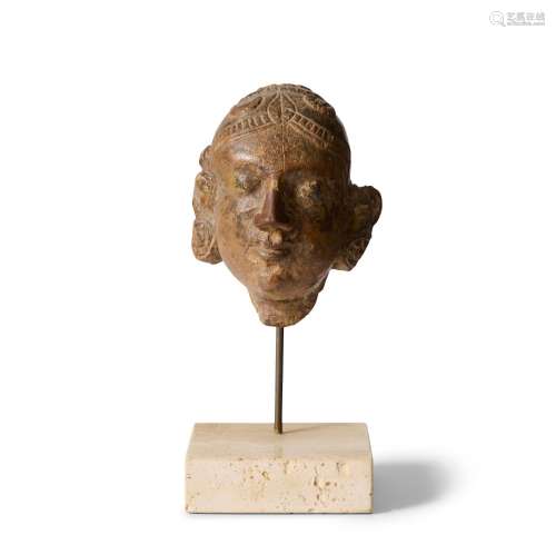 AN INDIAN CARVED WOOD HEAD OF A FEMALE 19TH CENTURY