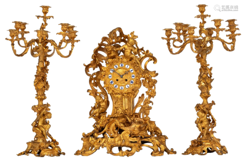 A very imposing Rococo style gilt bronze three-piece