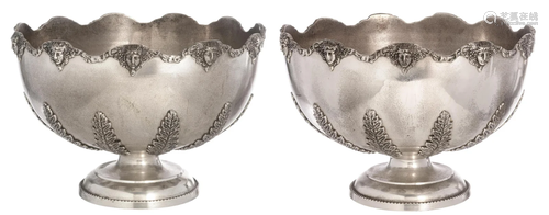 A pair of relief decorated silver-plated punchbowls,