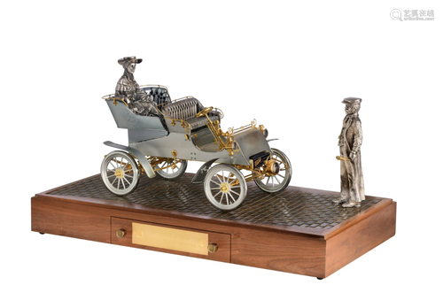 A scale reproduction of a '1903 Model A Ford', silver,