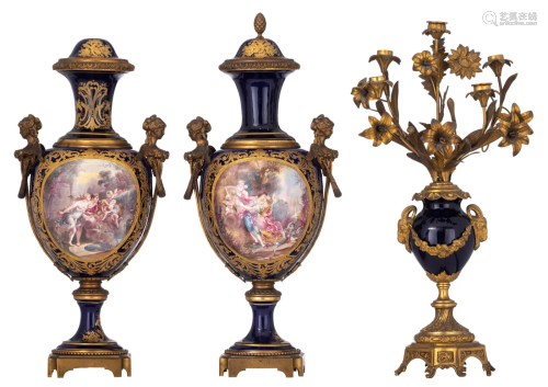 A pair of SÃ¨vres vases and a matching candelabra, H