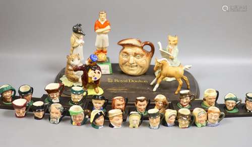 A collection of Royal Doulton miniature character mugs, figu...