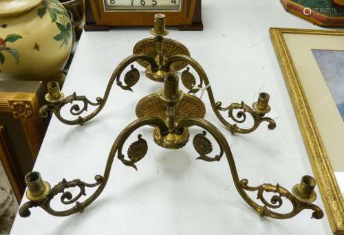 A pair of brass two-branch wall lights, 41 cm wide