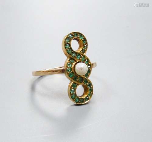 A yellow metal, cultured pearl and emerald set triple loop d...