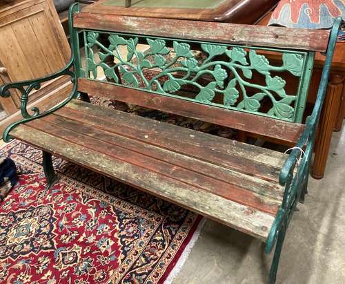 A cast iron and wood garden bench