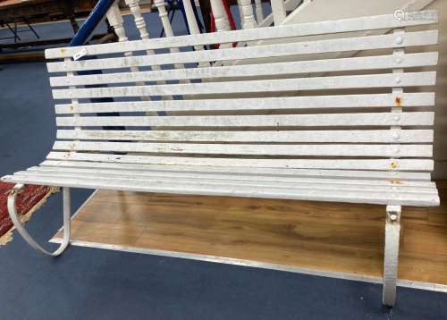 A slatted wood and wrought iron garden bench, length 177cm, ...