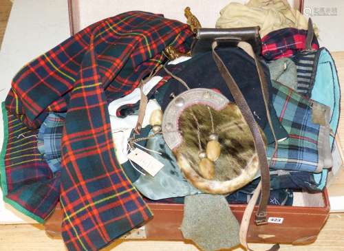 A group of early 20th century men’s and women’s tartan cloth...