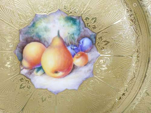 A Royal Worcester fruit painted and gilt tooled cabinet plat...