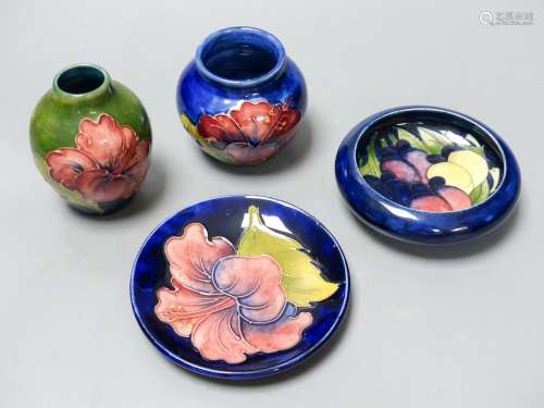 Two Moorcroft Hibiscus pattern vases and a similar dish toge...