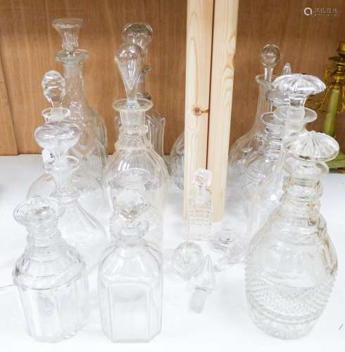 A collection of thirteen cut glass decanters