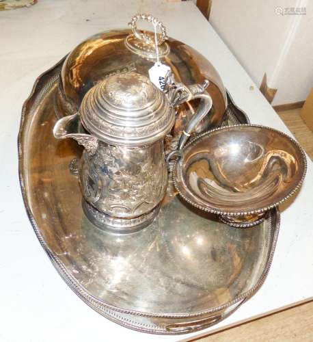 A Victorian embossed silver plated jug, oval tray, meat cove...