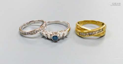 Three modern dress rings including a 750 yellow metal and se...