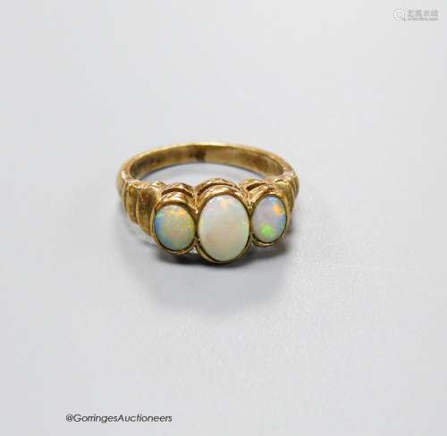 A 9ct gold and three stone white opal set half hoop ring, wi...