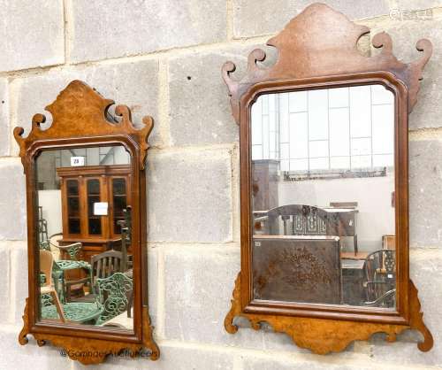 A pair of 18th century style walnut fret cut wall mirrors, w...