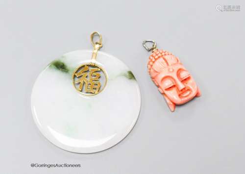 A Chinese jade disc pendant with inset yellow metal characte...